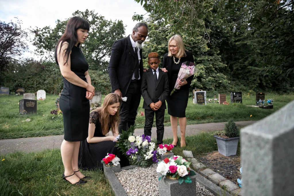 family visiting grave love one for condolence