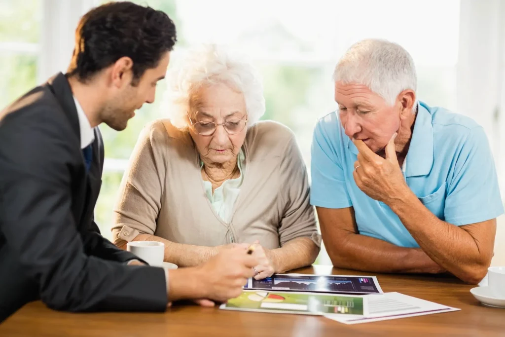 Final expense representative showing sheets senior couple home