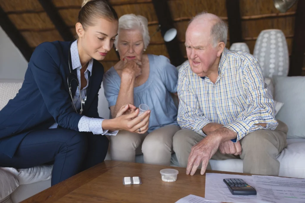 female doctor senior couple discussing medicine